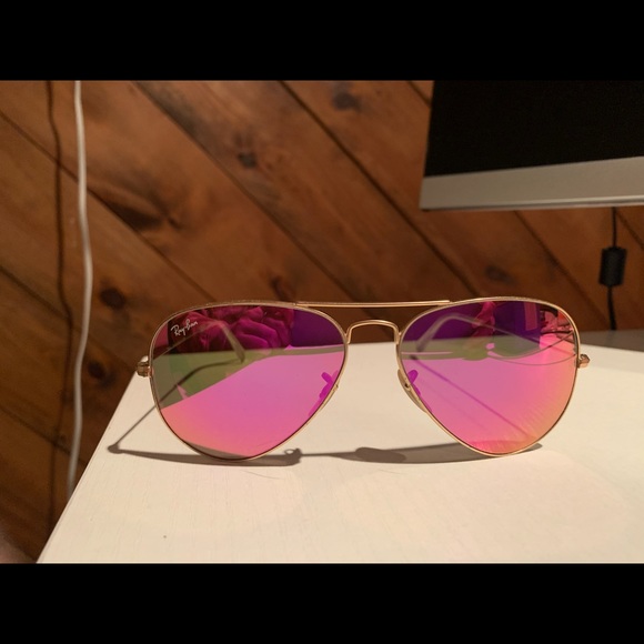 Pink reflective ray bans aviator sunglasses.